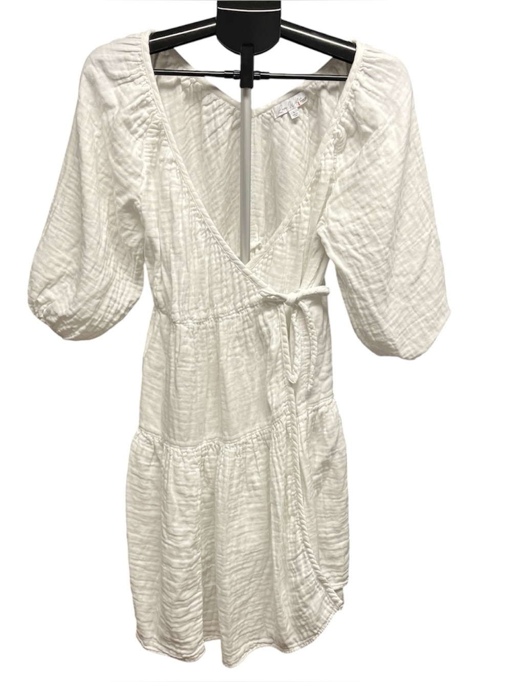 Love, Whit by Whitney Port. White Gauze Wrap Dress with Puff Sleeves.